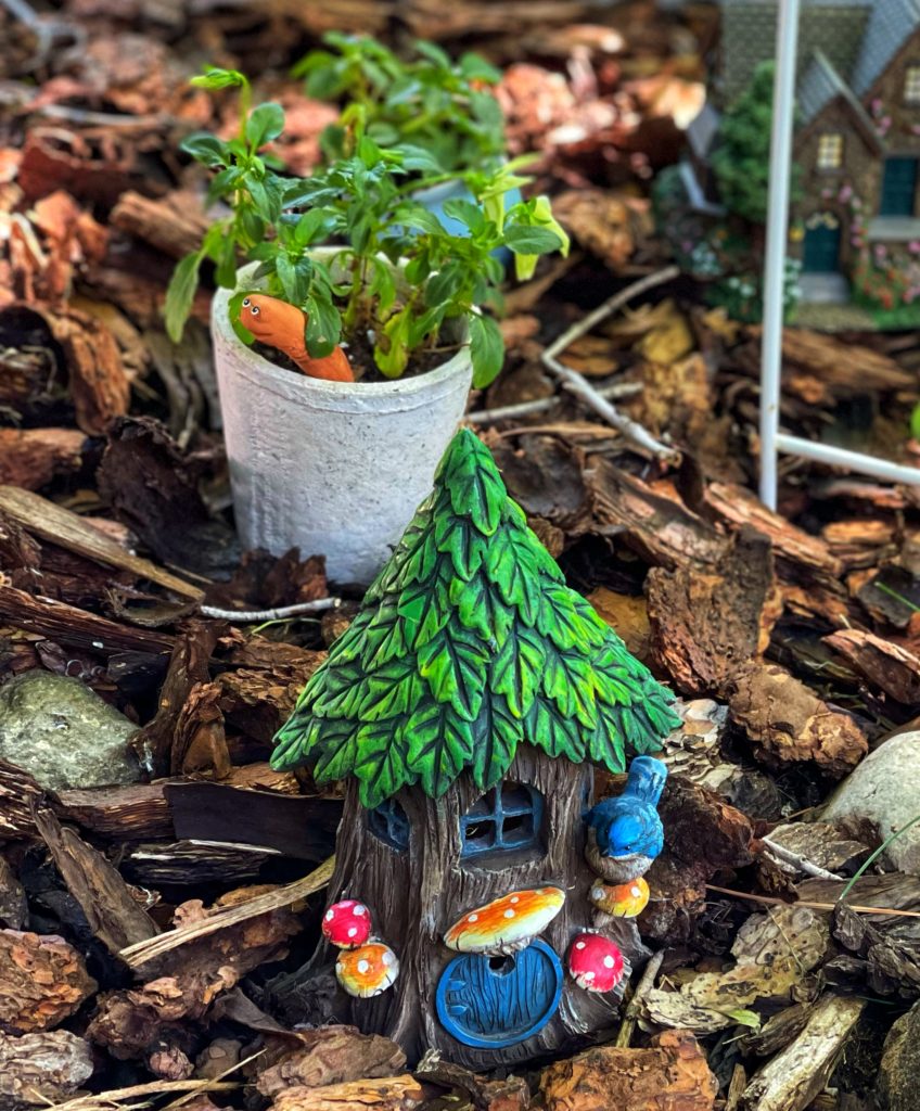 Image of fairy house with bluebird