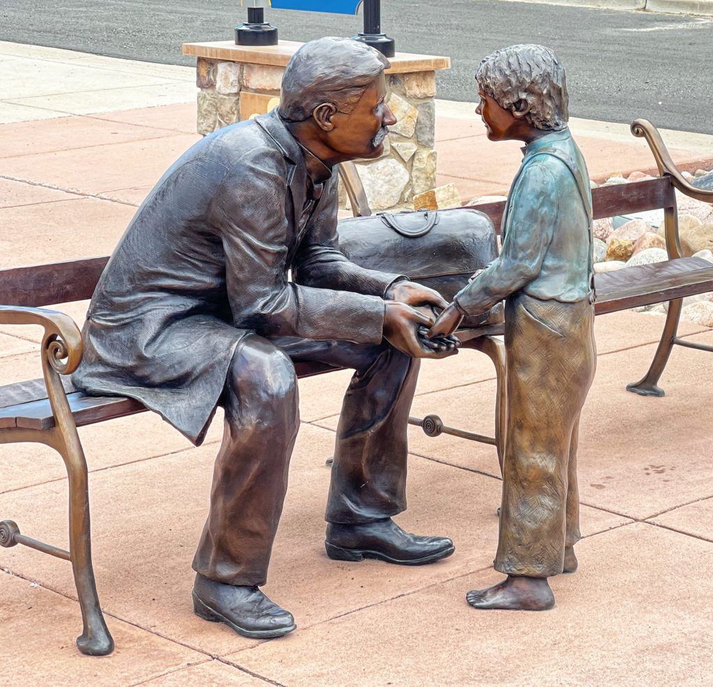 Image of bronze statue of doctor and little boy