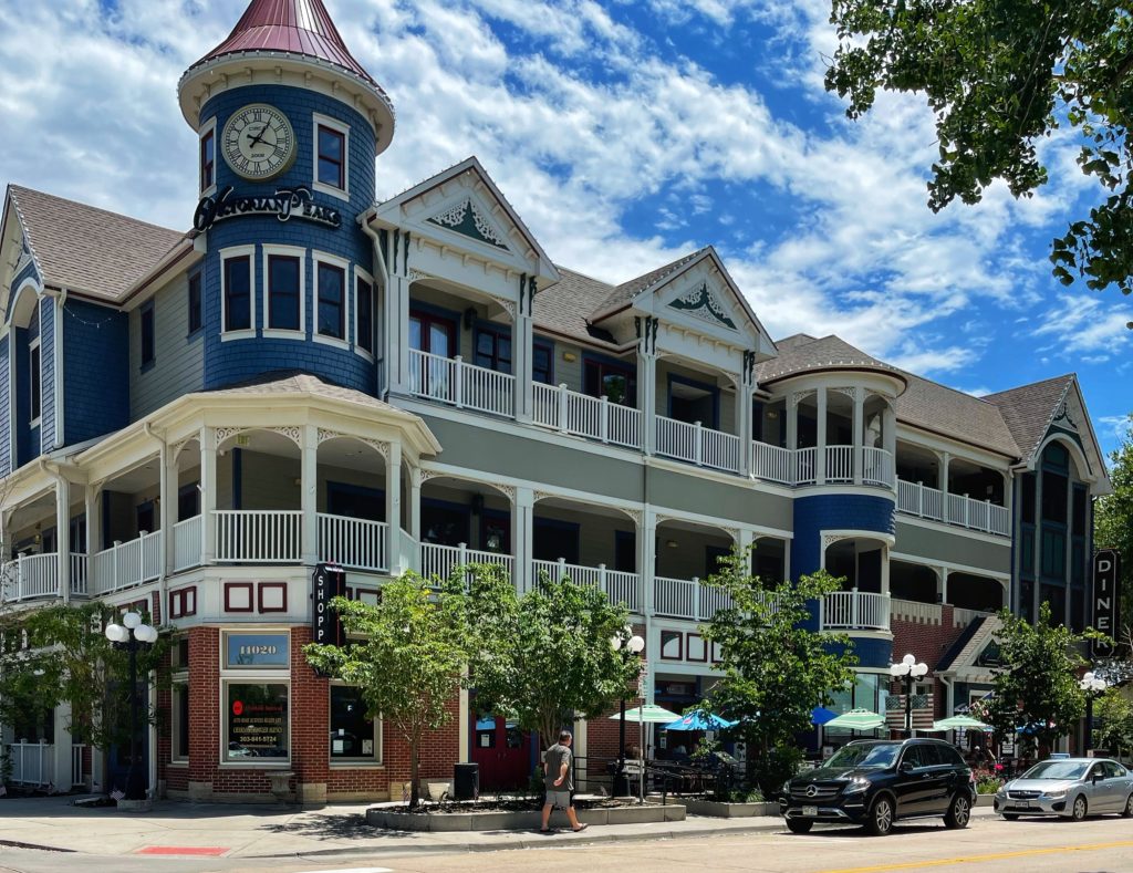 Image of stroll through town Blue Victorian house