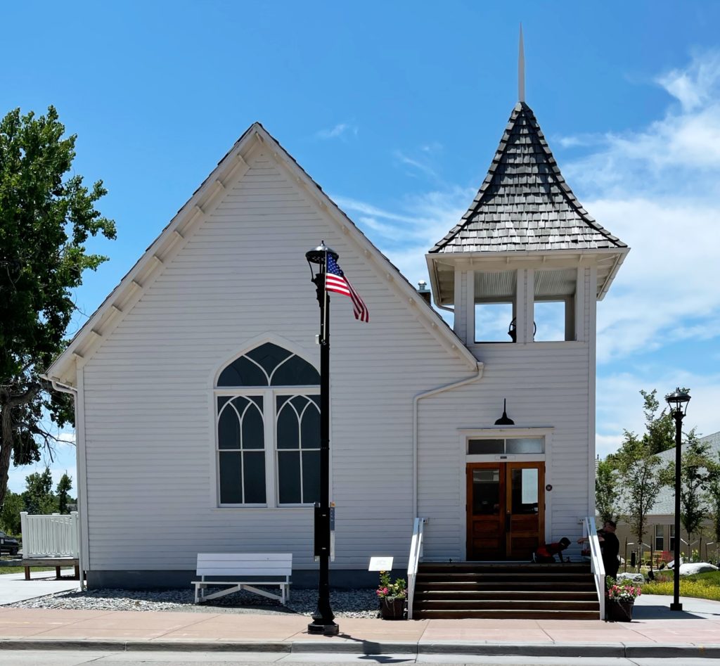 Image of Summer stroll through town little white church